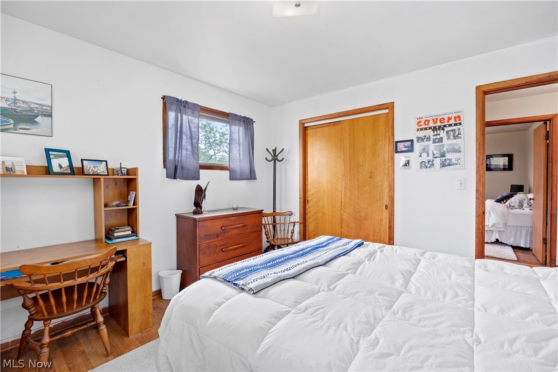 324 Erie Road Vermilion, OH 44089 - Photo 13 of 36 Bedroom with a closet and hardwood / wood-style floors