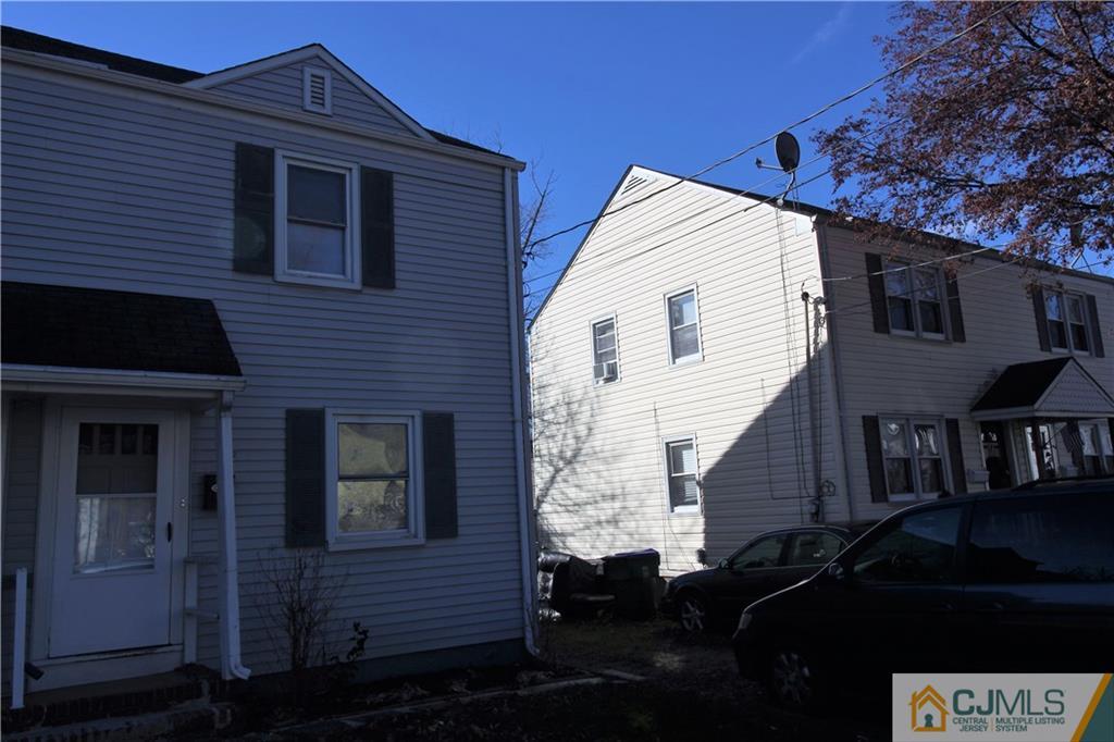 9 MacArthur Drive Edison, NJ 08837 - Photo 2 of 24 a front view of a house with a yard