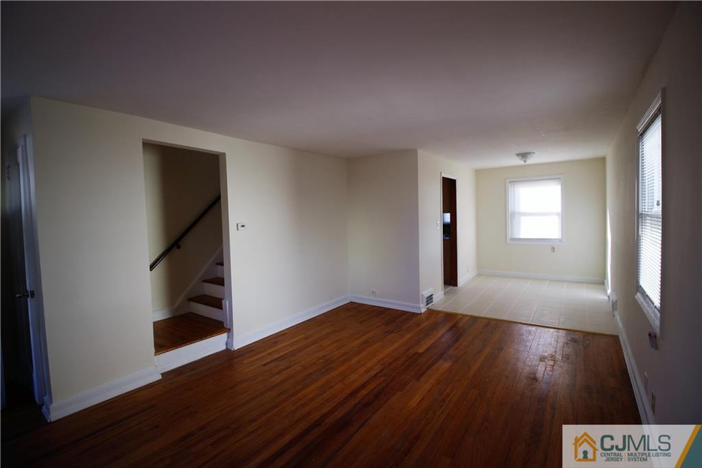 9 MacArthur Drive Edison, NJ 08837 - Photo 16 of 24 wooden floor in an empty room with a window