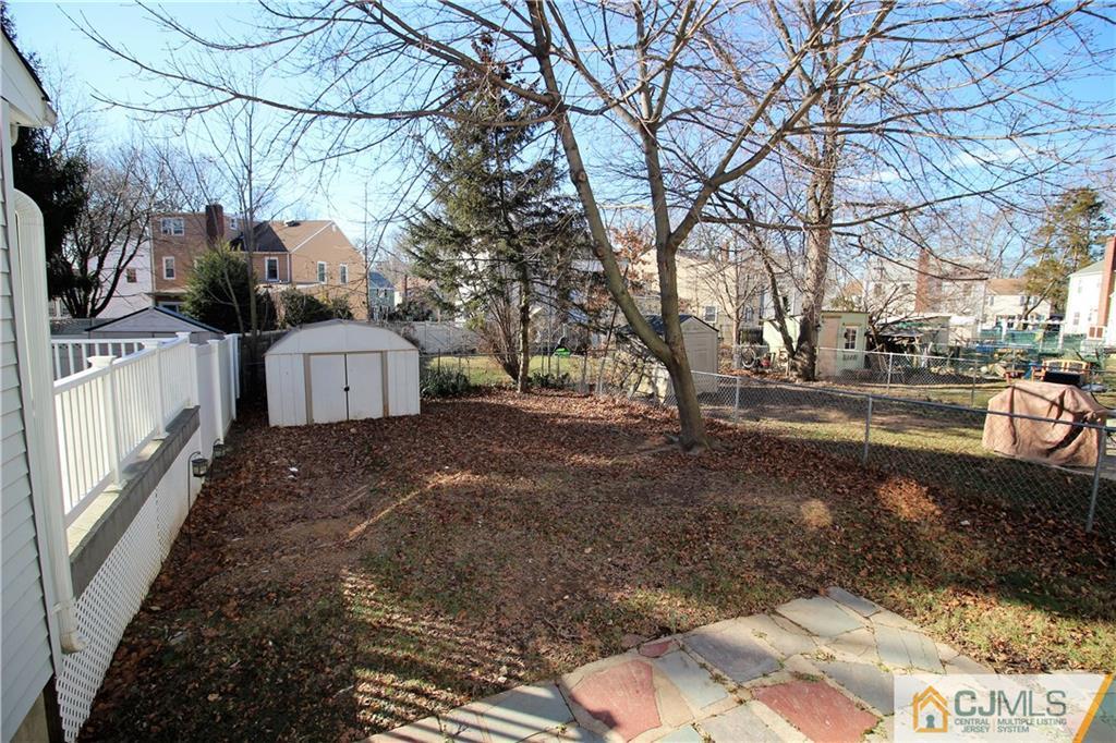 9 MacArthur Drive Edison, NJ 08837 - Photo 18 of 24 a front view of a house with a yard
