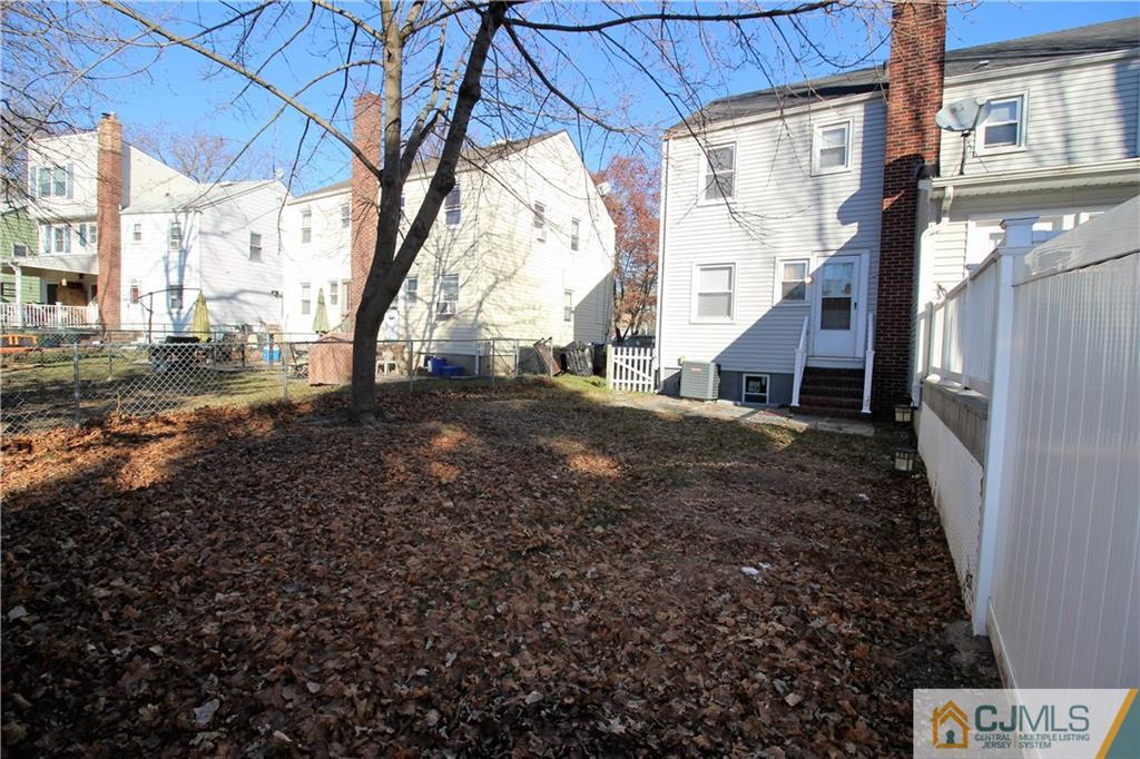 9 MacArthur Drive Edison, NJ 08837 - Photo 19 of 24 a view of a yard with an outdoor space