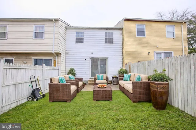 a view of a backyard with a fence