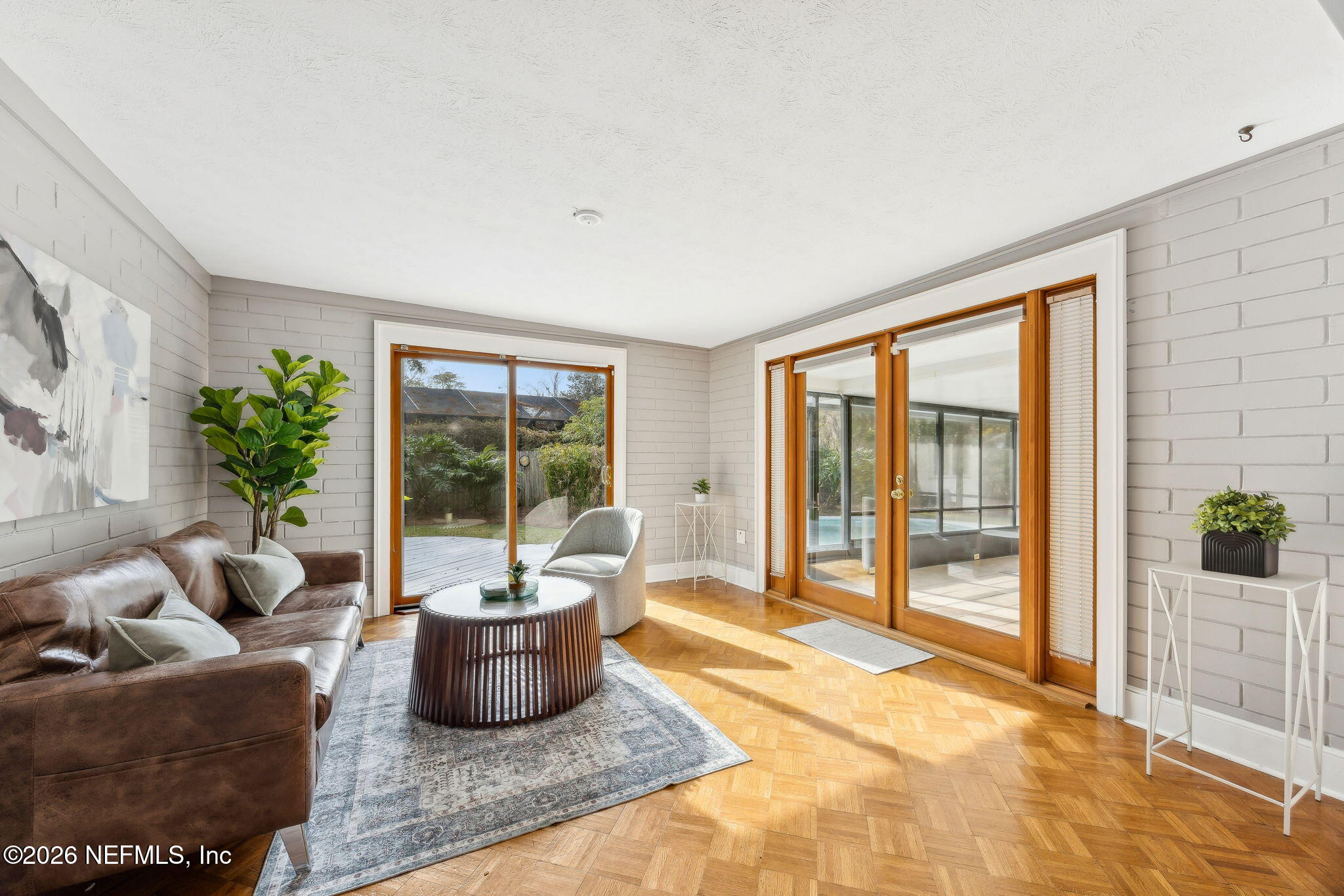 3648 Rubin Road Jacksonville, FL 32257 - Photo 12 of 49 a living room with furniture and a potted plant