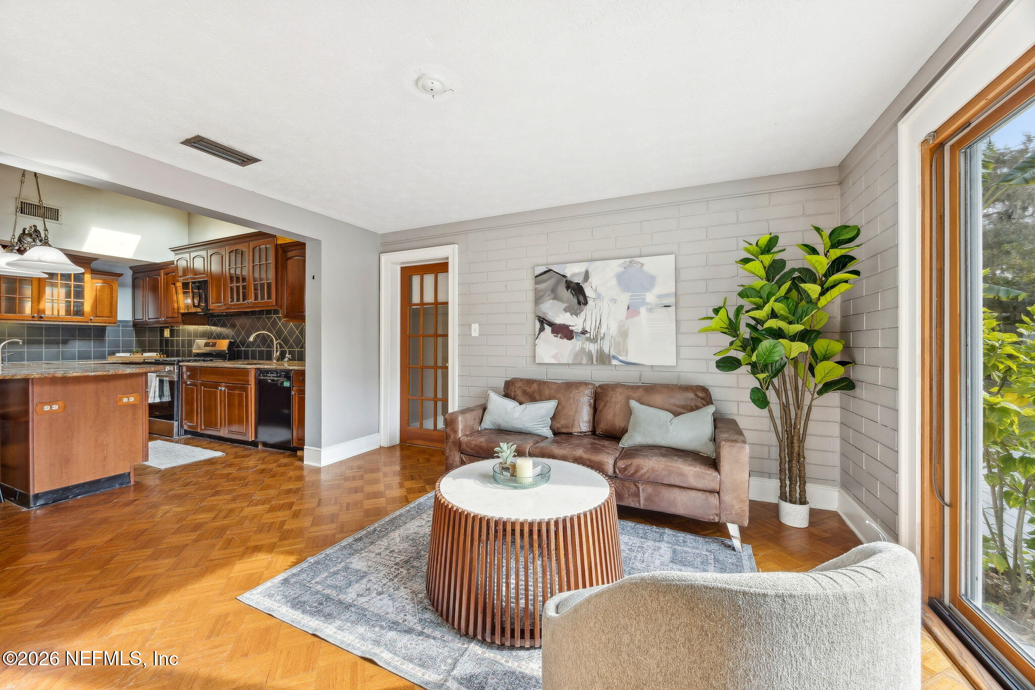 3648 Rubin Road Jacksonville, FL 32257 - Photo 13 of 49 a living room with furniture and a dining table with kitchen view
