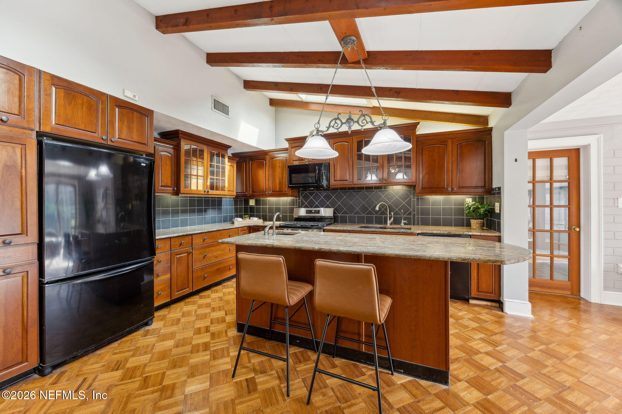3648 Rubin Road Jacksonville, FL 32257 - Photo 14 of 49 a kitchen with stainless steel appliances granite countertop a refrigerator a stove and a sink