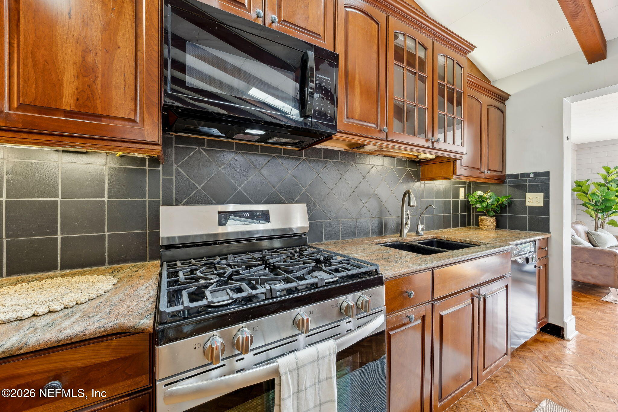 3648 Rubin Road Jacksonville, FL 32257 - Photo 16 of 49 a kitchen with stainless steel appliances granite countertop a stove and a sink