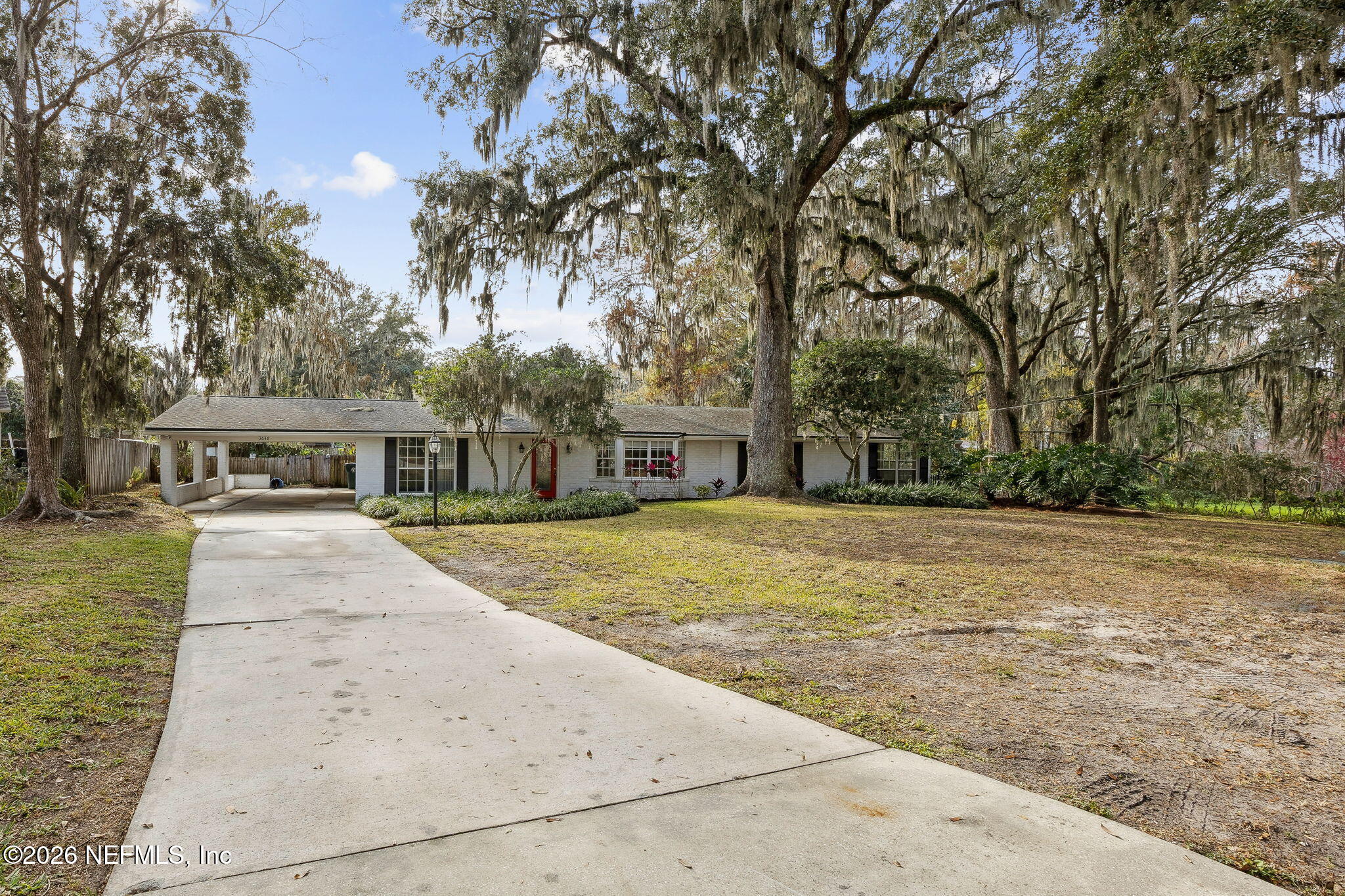 3648 Rubin Road Jacksonville, FL 32257 - Photo 2 of 49 a front view of a house with a yard