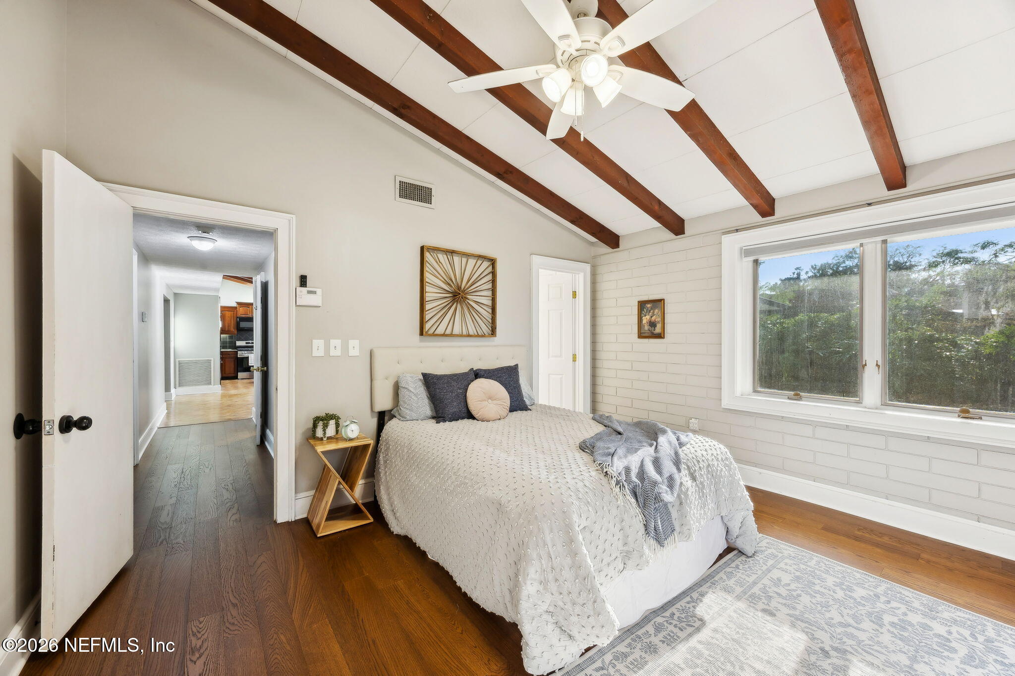 3648 Rubin Road Jacksonville, FL 32257 - Photo 25 of 49 a bedroom with a bed and a large window with wooden floor