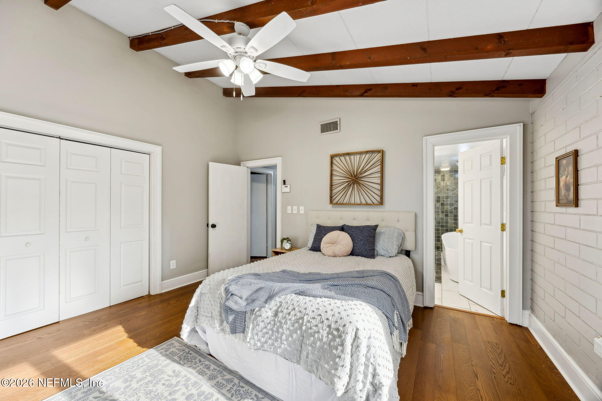 3648 Rubin Road Jacksonville, FL 32257 - Photo 26 of 49 a bedroom with a bed and a chandelier