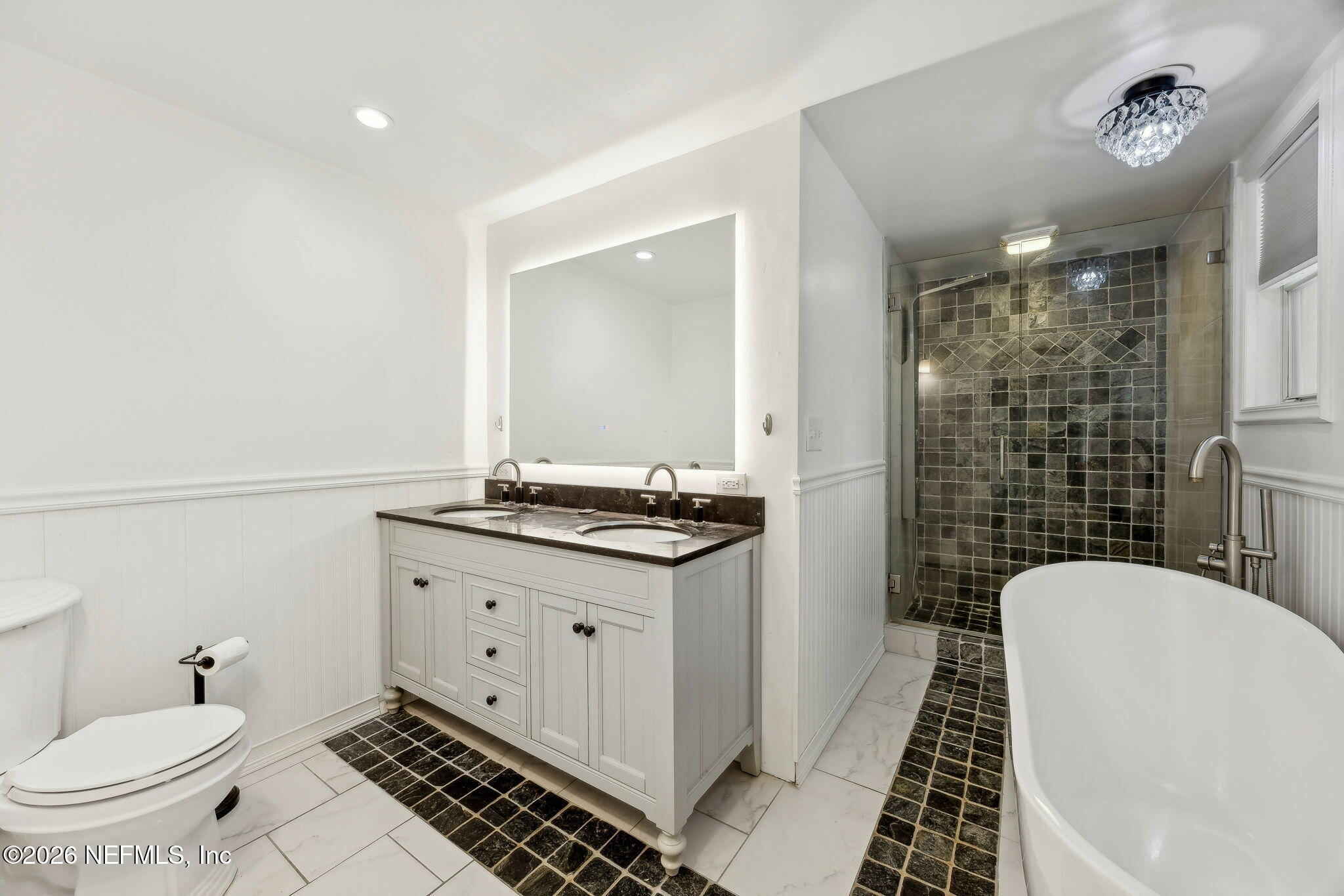 3648 Rubin Road Jacksonville, FL 32257 - Photo 28 of 49 a bathroom with a sink a toilet a mirror and shower