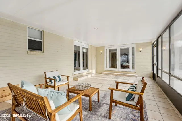 a outdoor living space with furniture and a flat screen tv