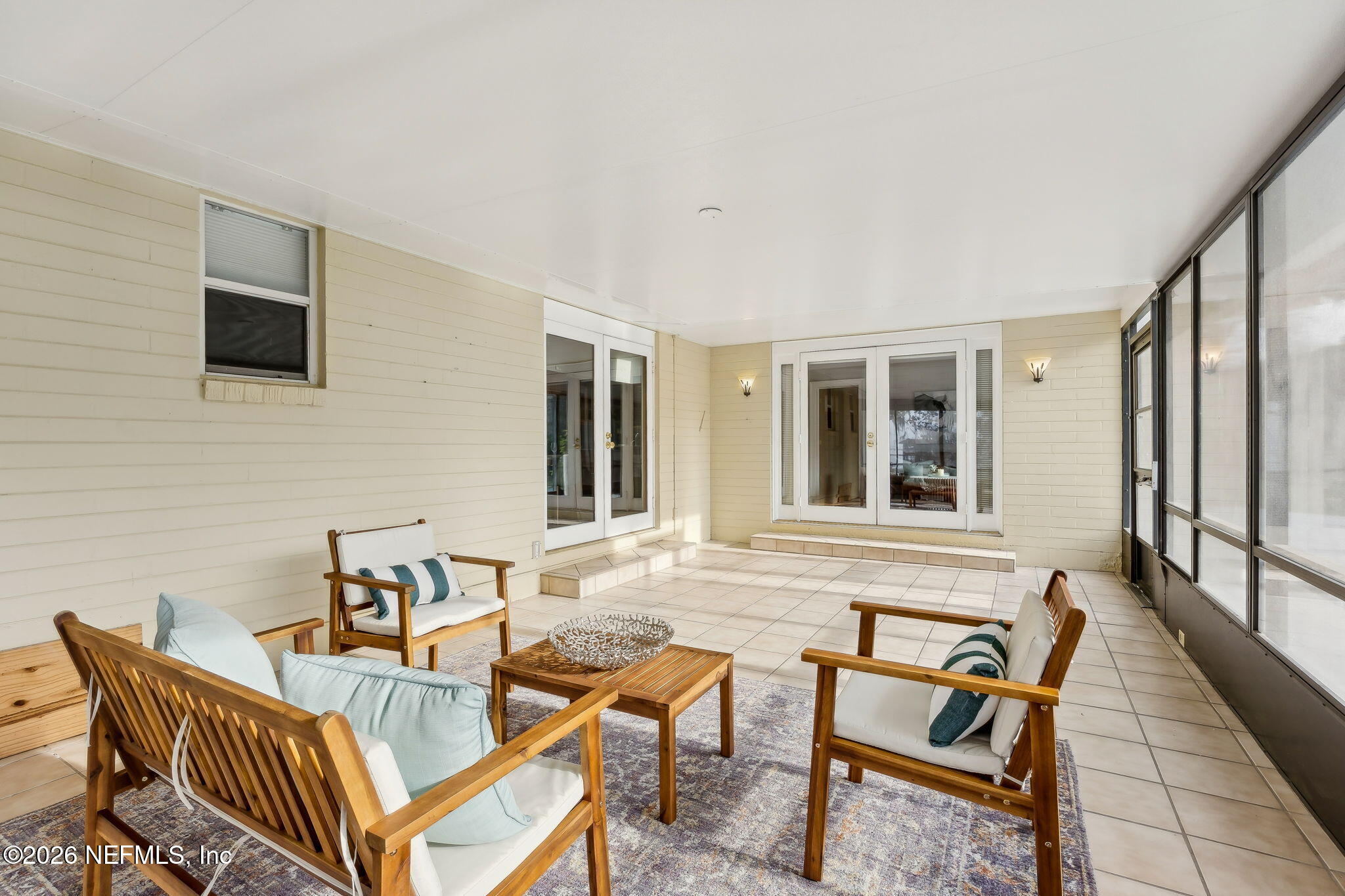 3648 Rubin Road Jacksonville, FL 32257 - Photo 38 of 49 a outdoor living space with furniture and a flat screen tv