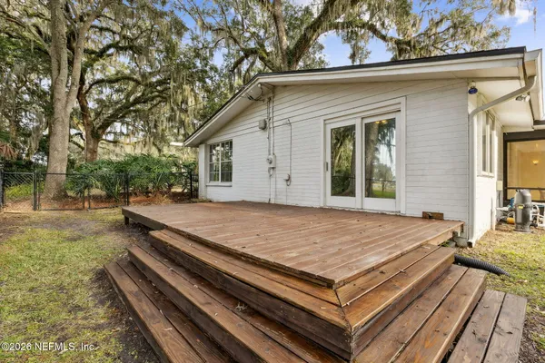 a view of a backyard with sitting area