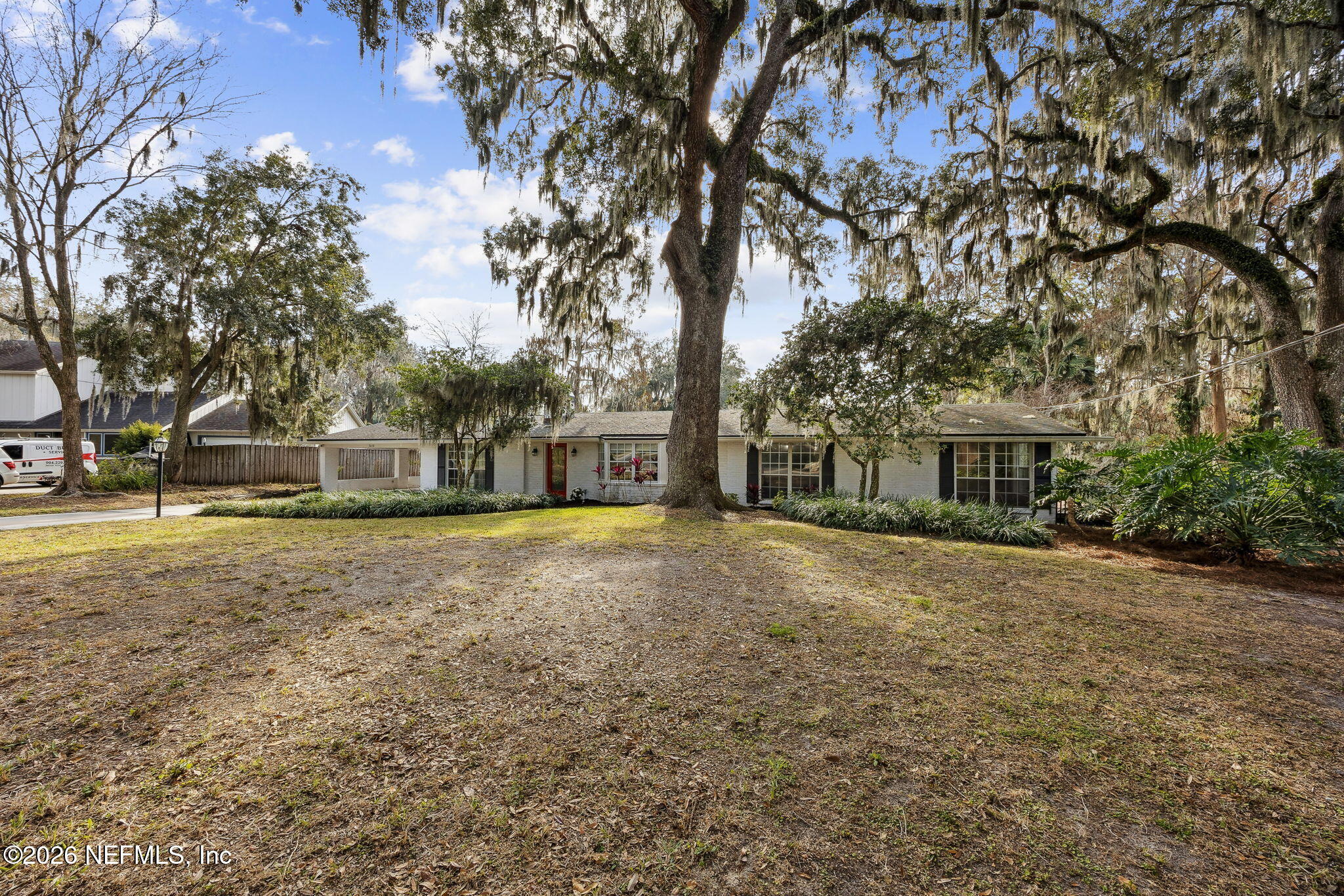 3648 Rubin Road Jacksonville, FL 32257 - Photo 5 of 49 a front view of a house with a garden
