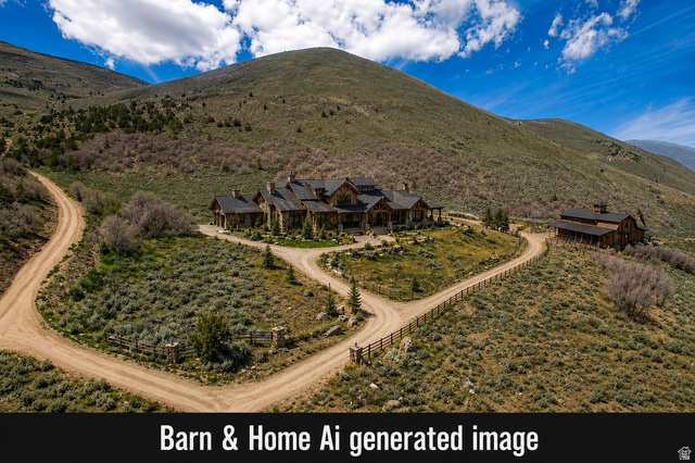 1646 North Miles Holw Road, Unit 29 Kamas, UT 84036 - Photo 12 of 35 Expansive mountain property featuring a stone and timber residence, separate barn structure, and two distinct dirt access roads
