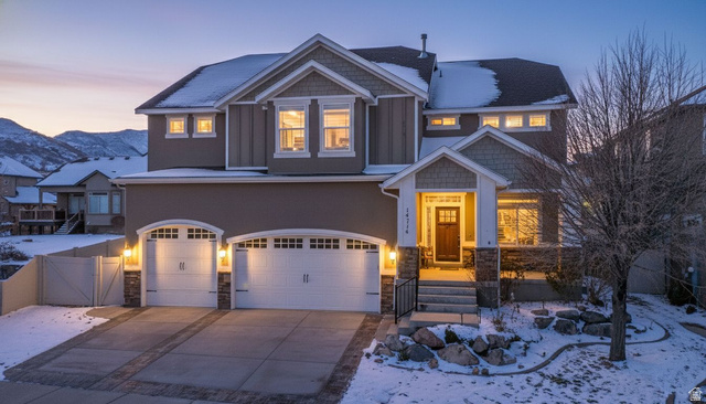 14714 South Bright Wood Road Herriman, UT 84096 - Photo 40 of 41 Craftsman inspired home with stone siding, an attached garage, a gate, and concrete driveway