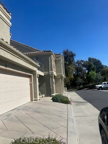 a view of a house with a street