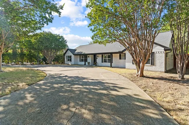 a house with trees in front of it