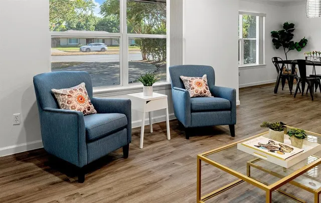 a living room with furniture and a table