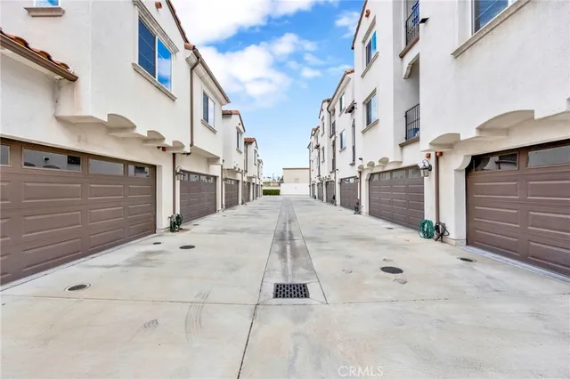 a view of a house with swimming pool and sitting area
