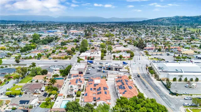 an aerial view of residential building with trees