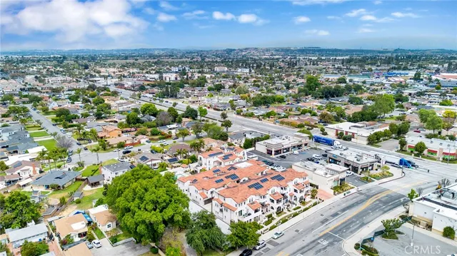 an aerial view of residential houses with city view