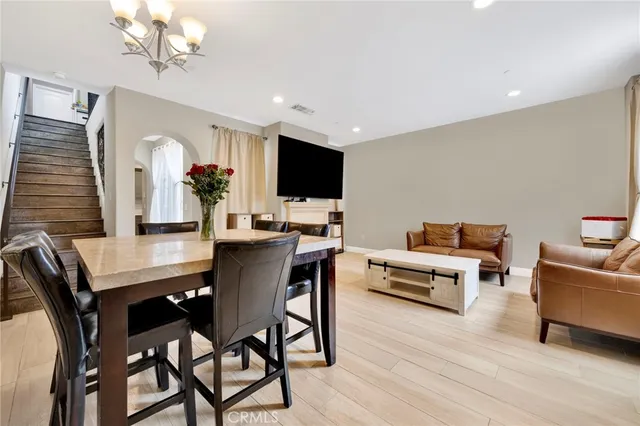 a kitchen with a refrigerator stove top oven and sink