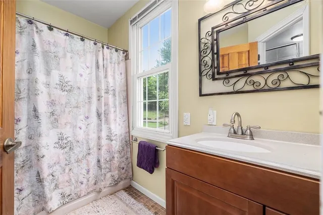 a bedroom with furniture and a book shelf