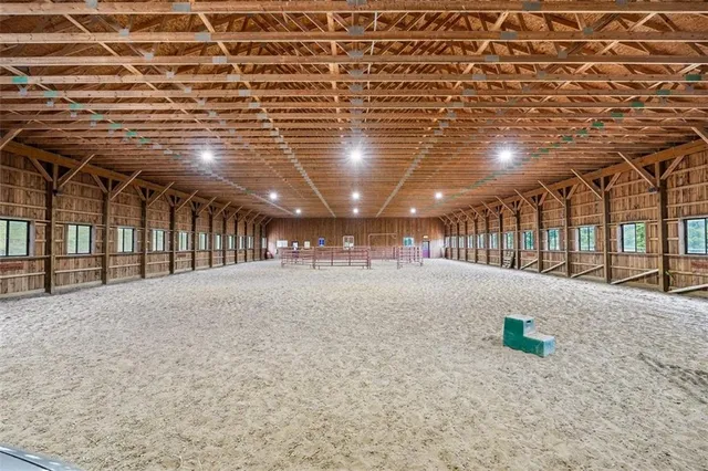 a living room with lots of furniture and a rug