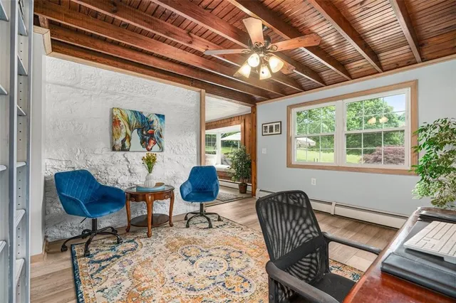 a living room with furniture and a bookshelf