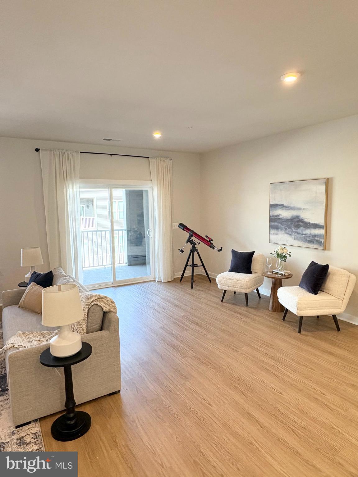 14114 Gypsum Loop, Unit 64 Chantilly, VA 20151 - Photo 11 of 40 a living room with furniture and a wooden floor