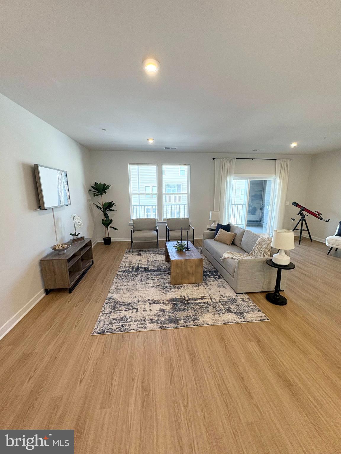 14114 Gypsum Loop, Unit 64 Chantilly, VA 20151 - Photo 12 of 40 a living room with furniture and a wooden floor