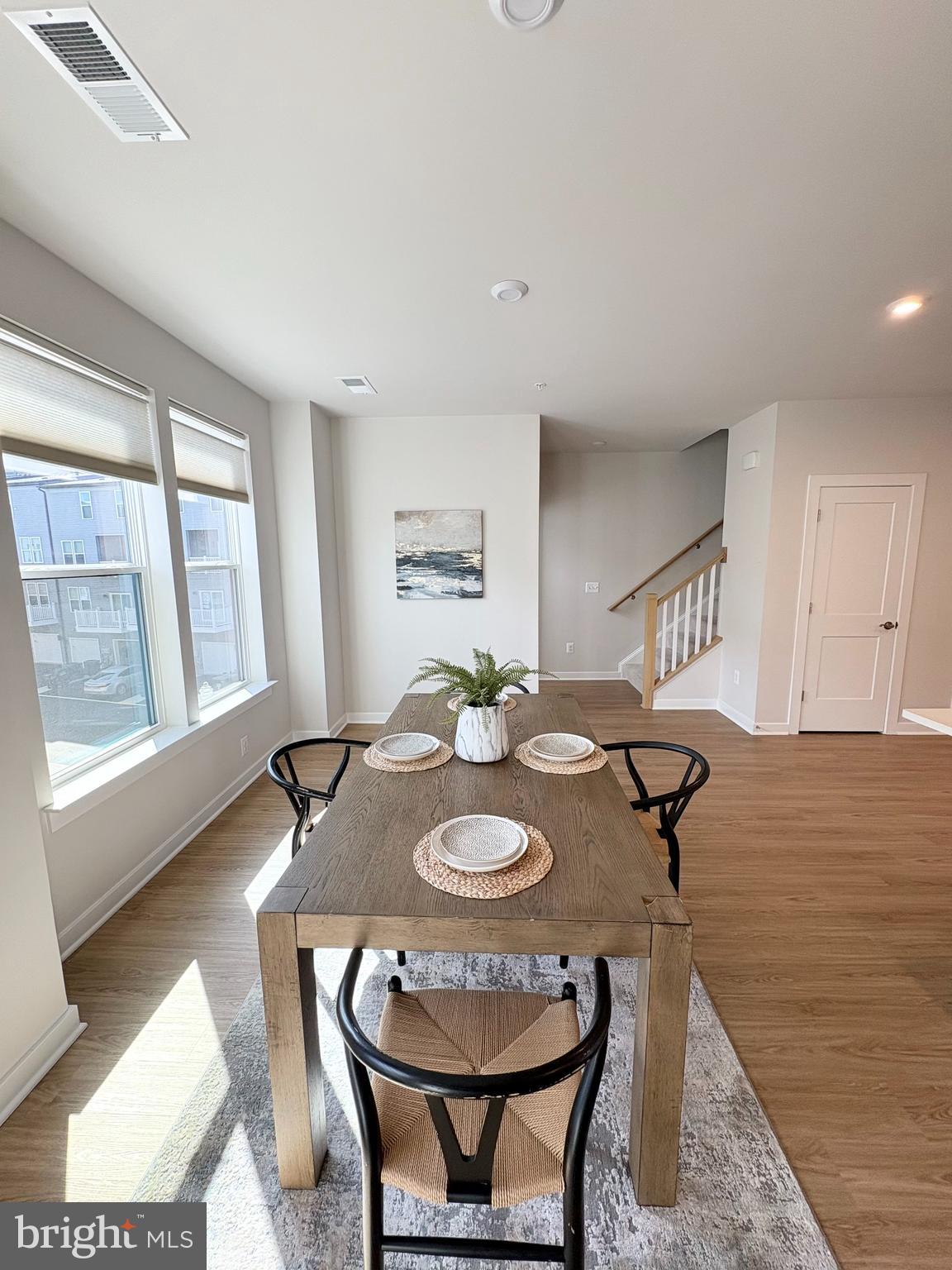 14114 Gypsum Loop, Unit 64 Chantilly, VA 20151 - Photo 13 of 40 a view of a dining room with furniture and wooden floor