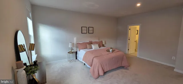 a bedroom with a bed and a mirror