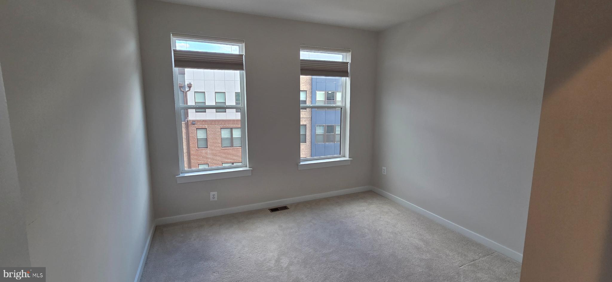 14114 Gypsum Loop, Unit 64 Chantilly, VA 20151 - Photo 31 of 40 an empty room with windows