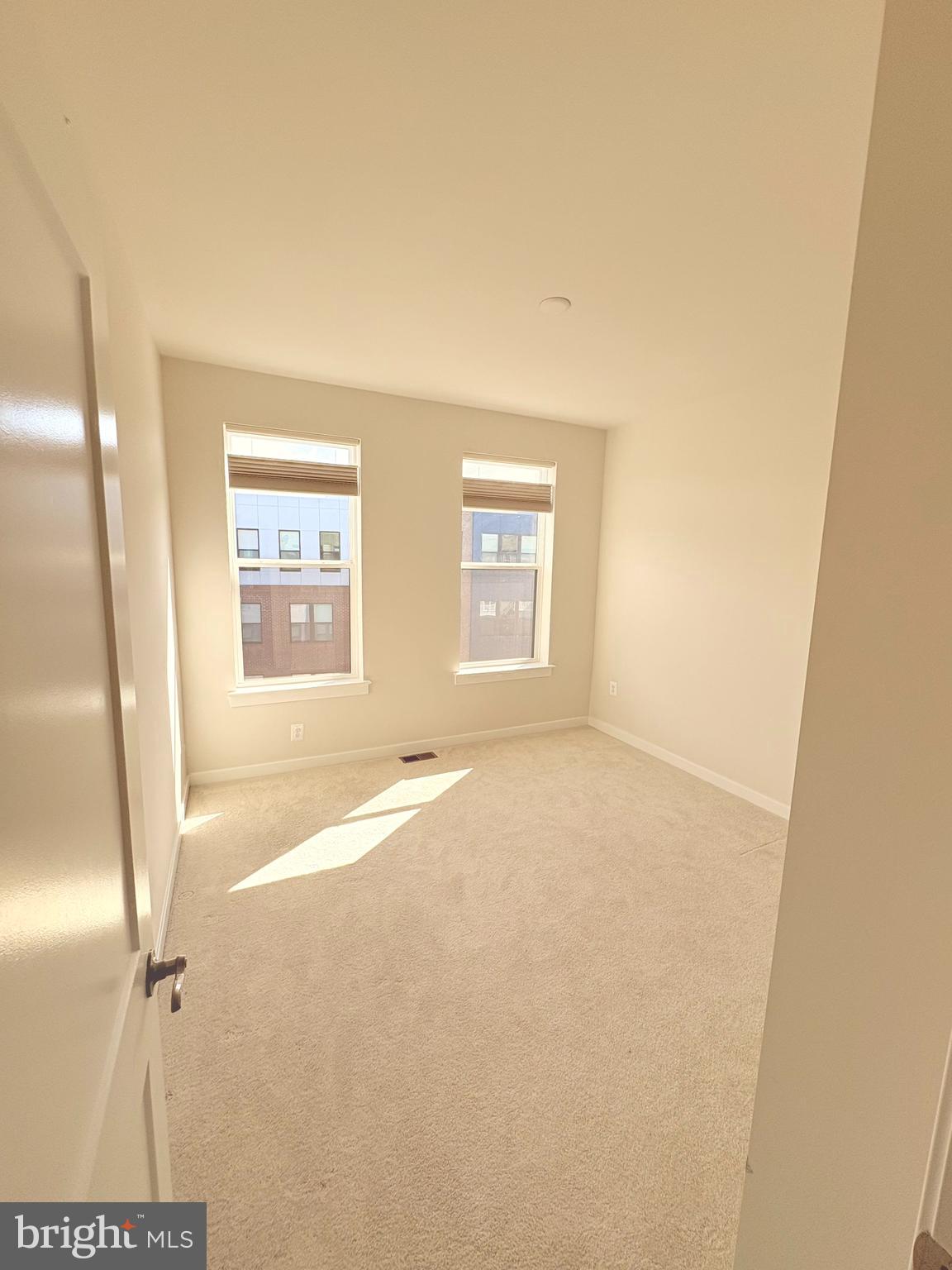 14114 Gypsum Loop, Unit 64 Chantilly, VA 20151 - Photo 32 of 40 an empty room with windows
