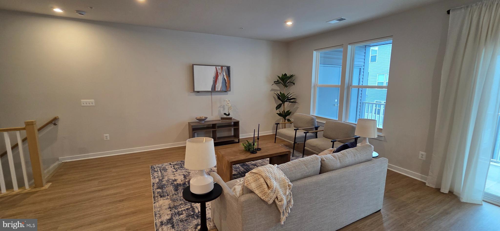 14114 Gypsum Loop, Unit 64 Chantilly, VA 20151 - Photo 6 of 40 a living room with furniture and a wooden floor