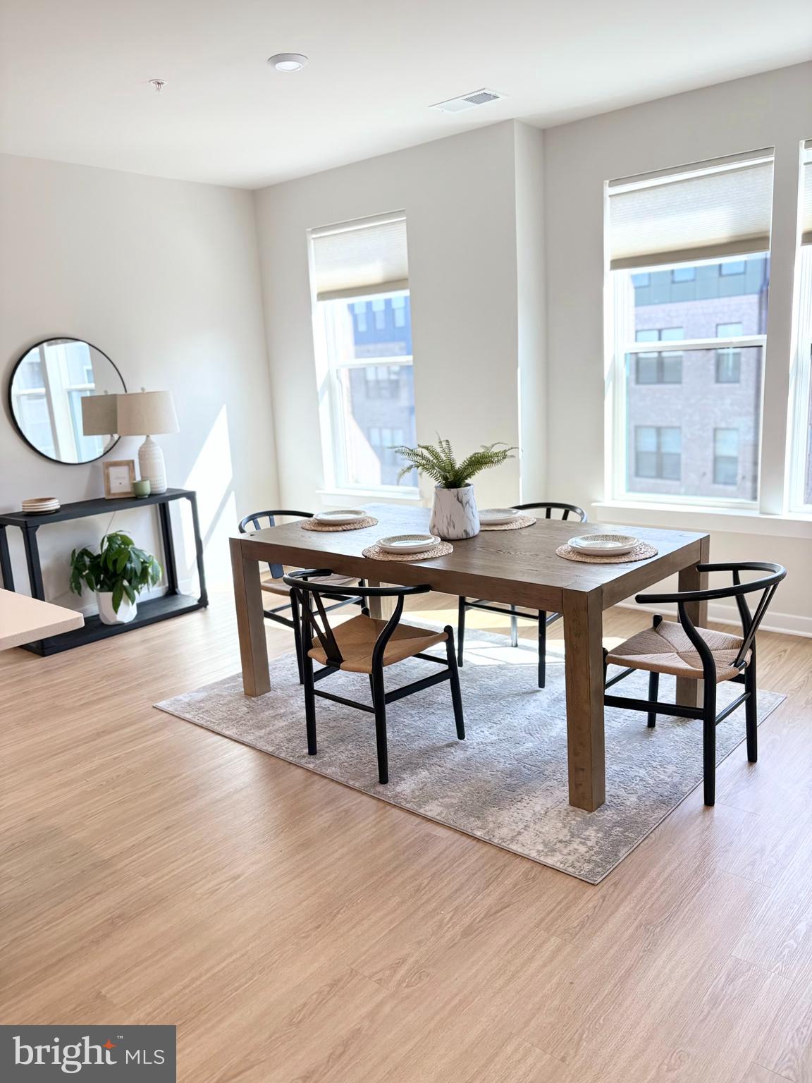 14114 Gypsum Loop, Unit 64 Chantilly, VA 20151 - Photo 8 of 40 a view of a dining room with furniture window and wooden floor