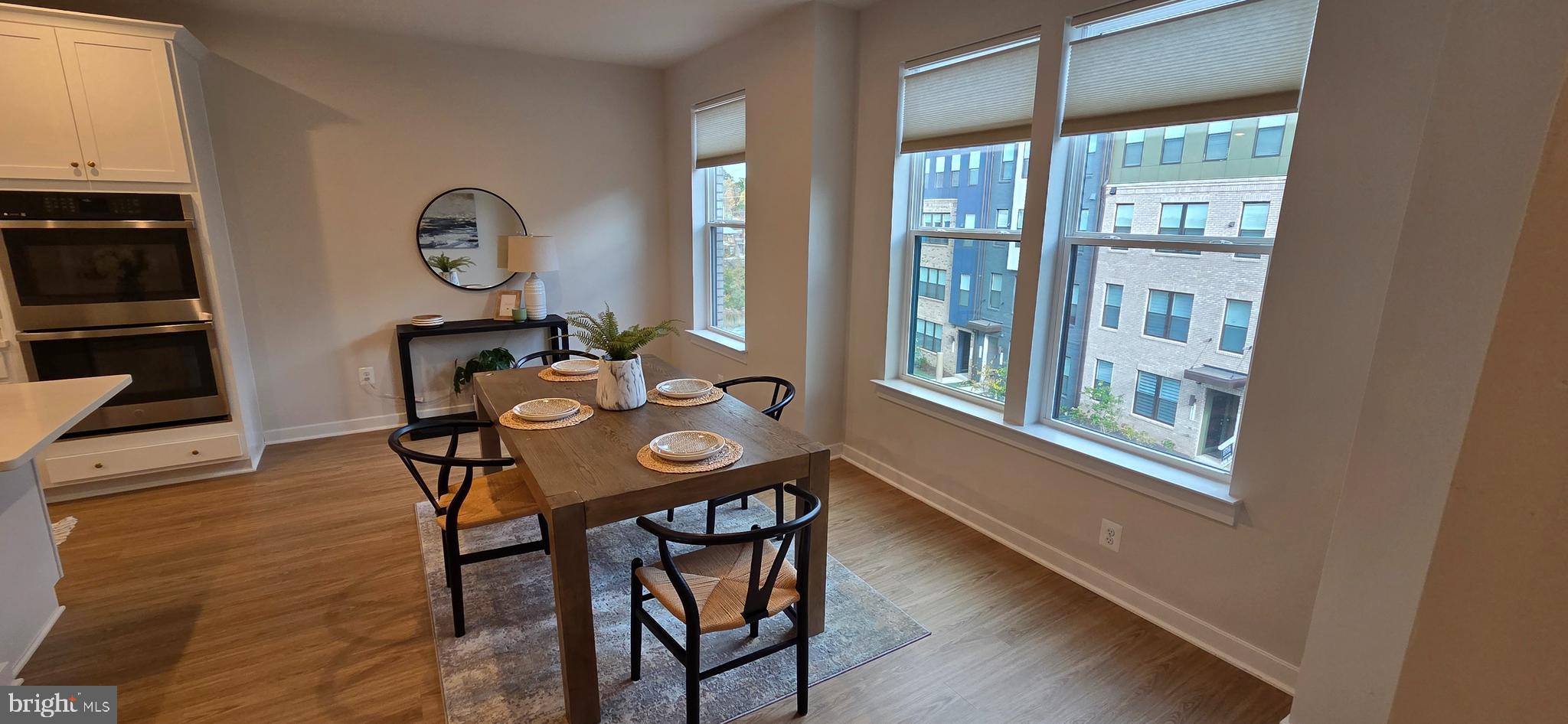 14114 Gypsum Loop, Unit 64 Chantilly, VA 20151 - Photo 9 of 40 a view of a dining room with furniture window and wooden floor