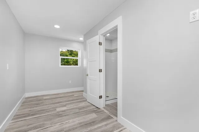 a view of a hallway with washer and dryer
