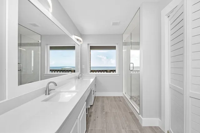 a bathroom with a sink a vanity and a mirror