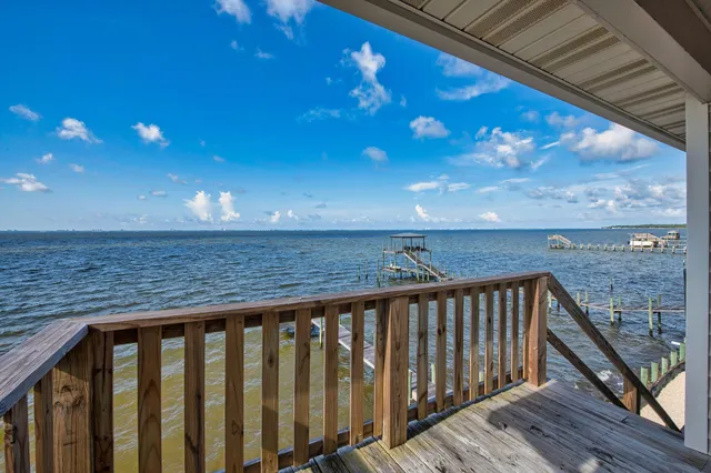 a view of a balcony with chairs