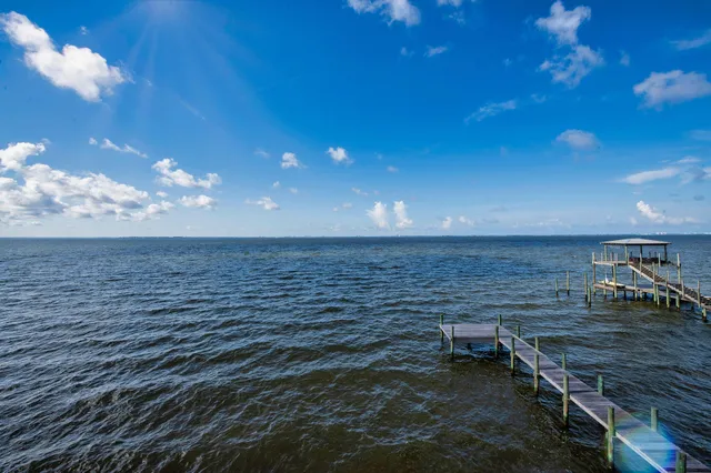 a front view of a house with a ocean view