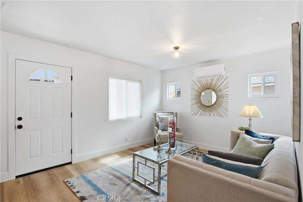 845 North 9th Street Colton, CA 92324 - Photo 2 of 11 a living room with furniture and wooden floor