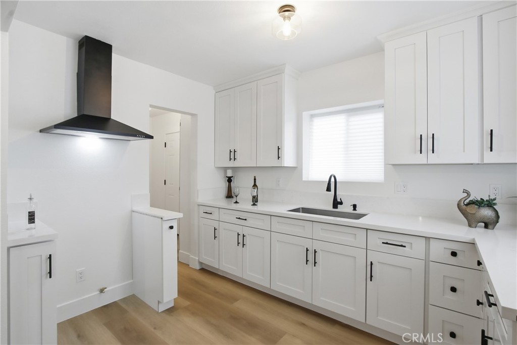 845 North 9th Street Colton, CA 92324 - Photo 5 of 11 a kitchen with white cabinets and sink
