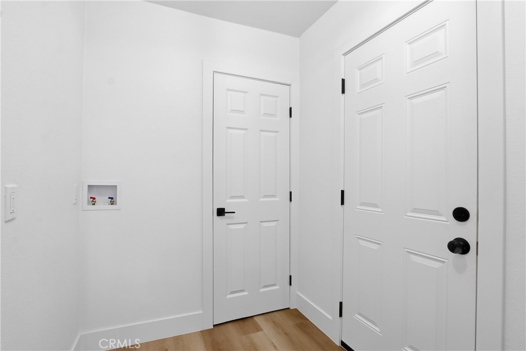 845 North 9th Street Colton, CA 92324 - Photo 7 of 11 a view of a hallway with wooden floor