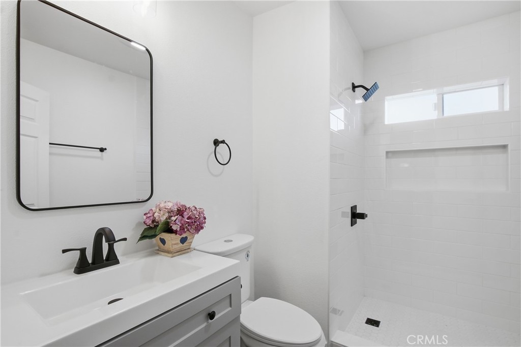 845 North 9th Street Colton, CA 92324 - Photo 9 of 11 a bathroom with a sink toilet and shower