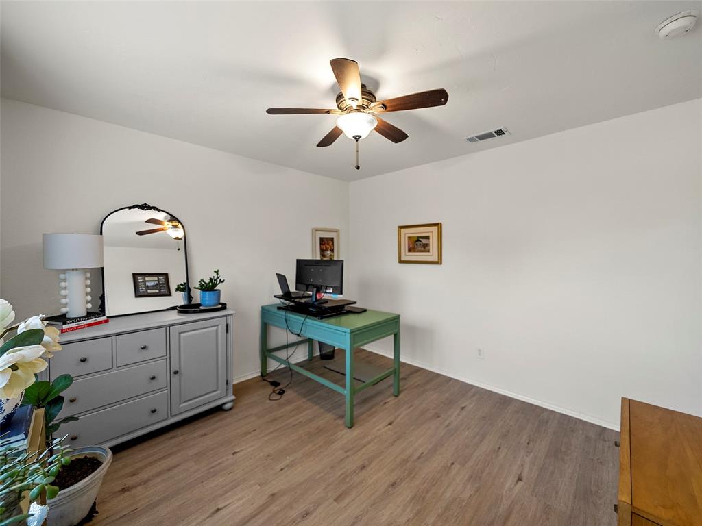 204 Arbor Ridge Drive Allen, TX 75002 - Photo 22 of 36 Interior room -Bedroom 2 featuring wood-finish flooring, a ceiling fan with integrated lighting, and white painted walls