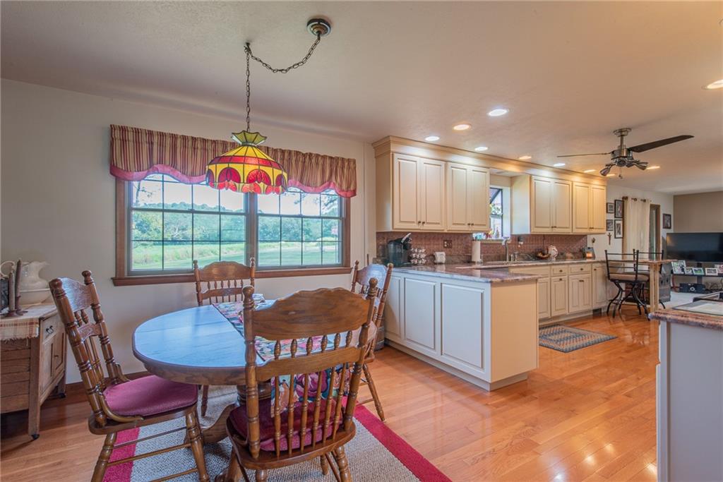 1453 Airport Road Vandergrift, PA 15690 - Photo 11 of 48 a kitchen with stainless steel appliances granite countertop a stove a kitchen island a stove a table and chairs