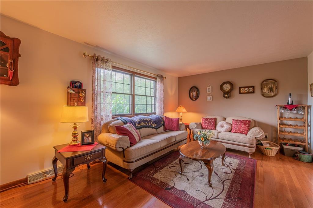 1453 Airport Road Vandergrift, PA 15690 - Photo 15 of 48 a living room with furniture a rug and a window